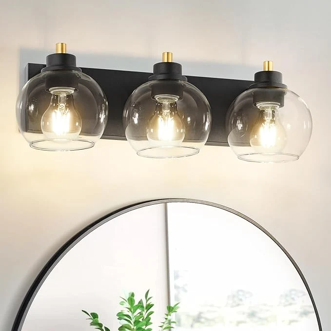 Environmentally Friendly Tuscarora 3 Light Bathroom Vanity Light Black and Gold Bathroom Light Fixtures Over Mirror Modern Vanity Light with Clear Glass Shade Black Wall Sconce for MirrorAbout ThisOverview Smart