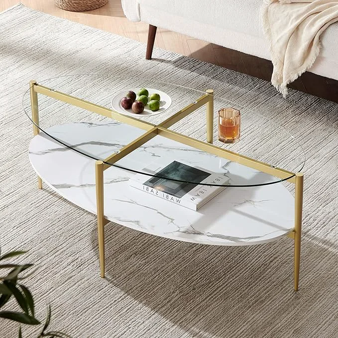 Smooth Oval Glass Coffee Table Mid-Century Modern Design L43 x W22 x H17 inch Surfboard Shaped Clear Glass Top and White Marble Finish Wood Shelf Tapered Legs with Gold Finish FrameAbout ThisOverview Next-Generation