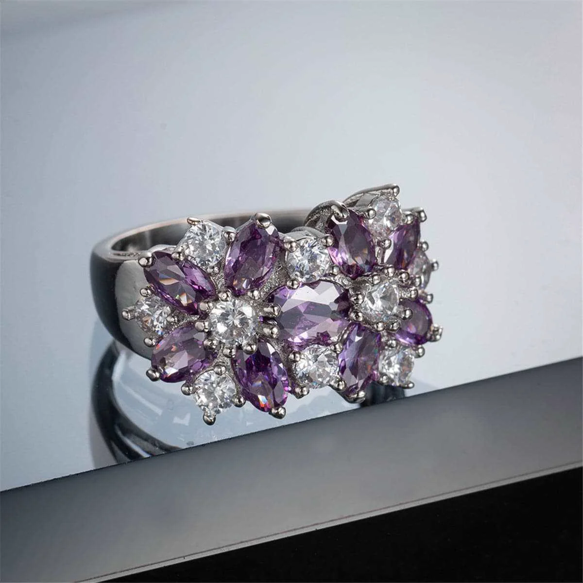 Advanced Purple Crystal Silvertone Floral Band Ring Responsible