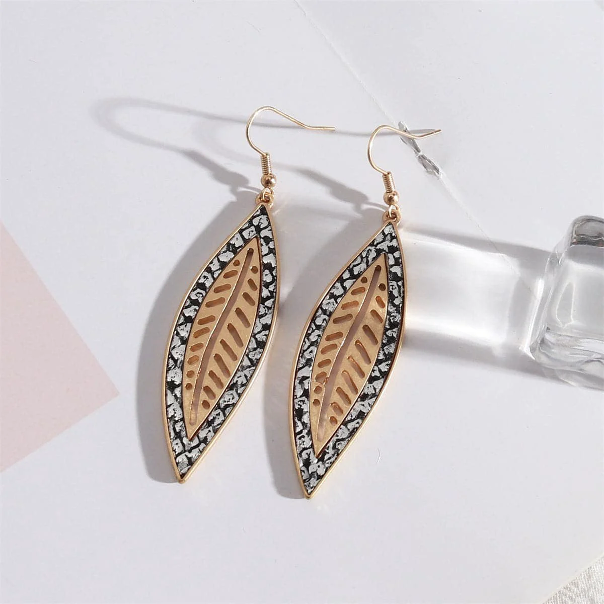 Contemporary White Polyurethane Goldtone Snakeskin-Embossed Leaf Drop Earrings Superior