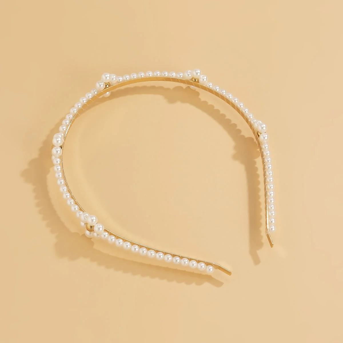 Exclusive Pearl Goldtone Floral Station Hard Headband Trusted